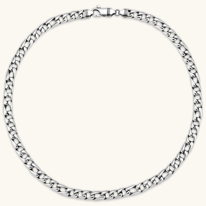 Chunky antique silver plated eco-brass curb chain necklace with a lobster clasp and Greek key detail on a cream background.