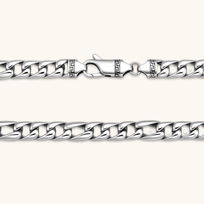 Chunky antique silver plated eco-brass curb chain necklace with a lobster clasp and Greek key detail on a cream background.