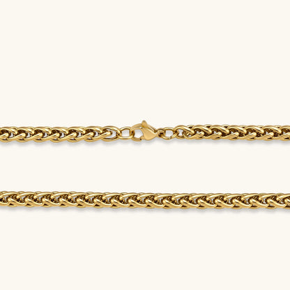 18K gold-plated stainless steel wheat chain necklace, 4.2mm wide, with lobster clasp, on off-white background.